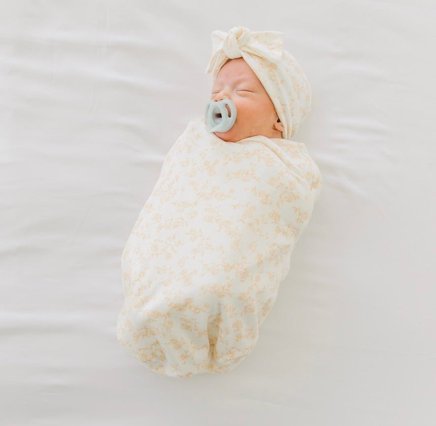 Cocoon swaddle baby blanket in Silky Modal fabric styles featuring the Bitty Blooms pattern.