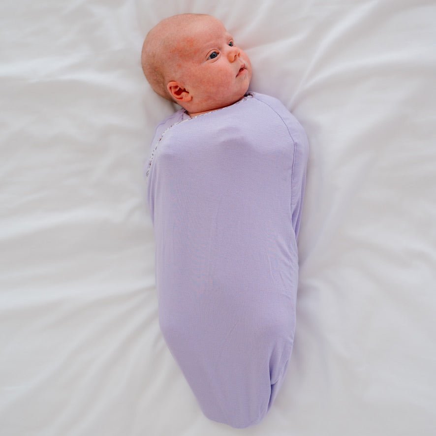 Cocoon swaddle baby blanket in Silky Modal fabric styles featuring the Purple Posies design.