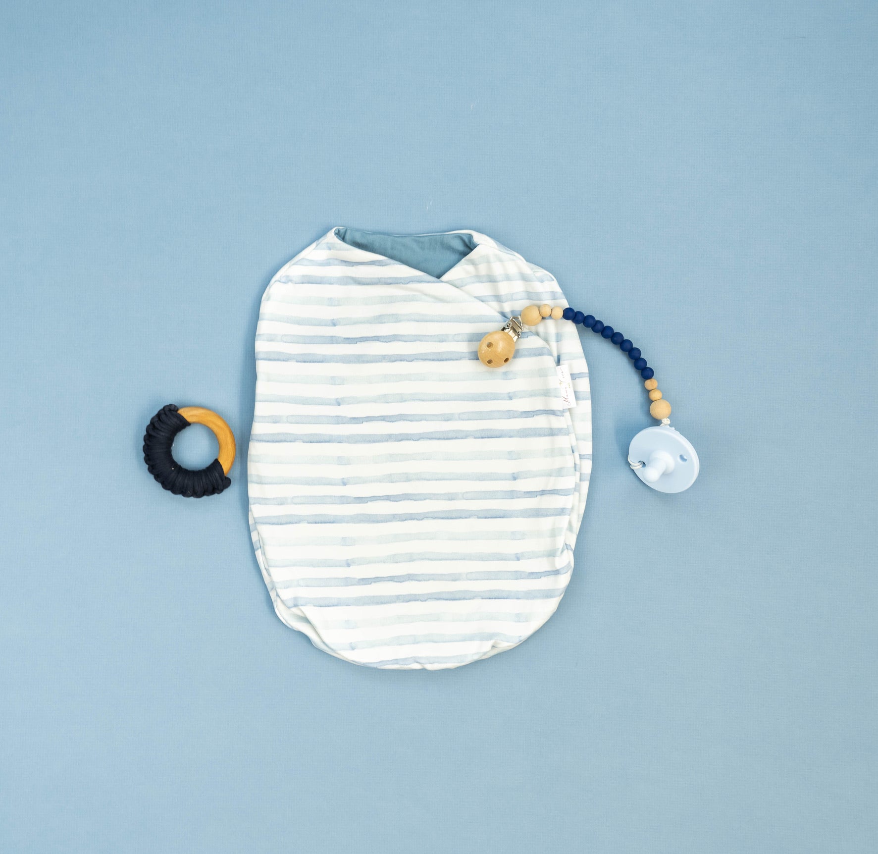 Chambray waves design cocoon baby swaddle in classic brushed fabric.