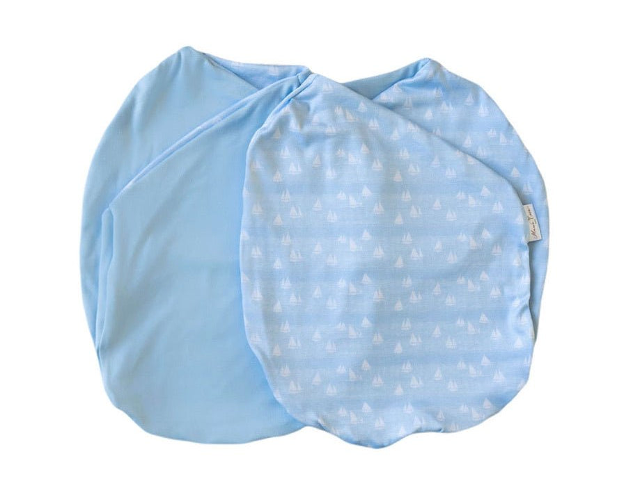 Sailboat shores design cocoon baby swaddle in classic brushed fabric.