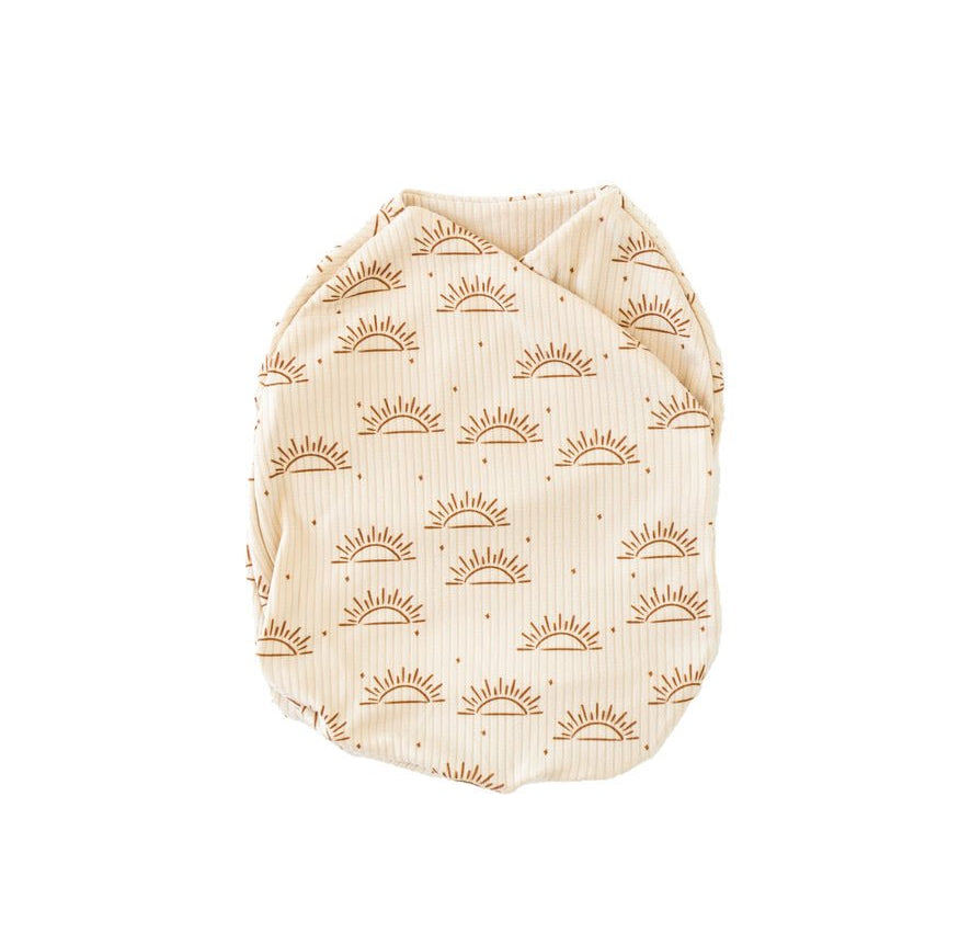 Sandy sunsets design cocoon swaddle.