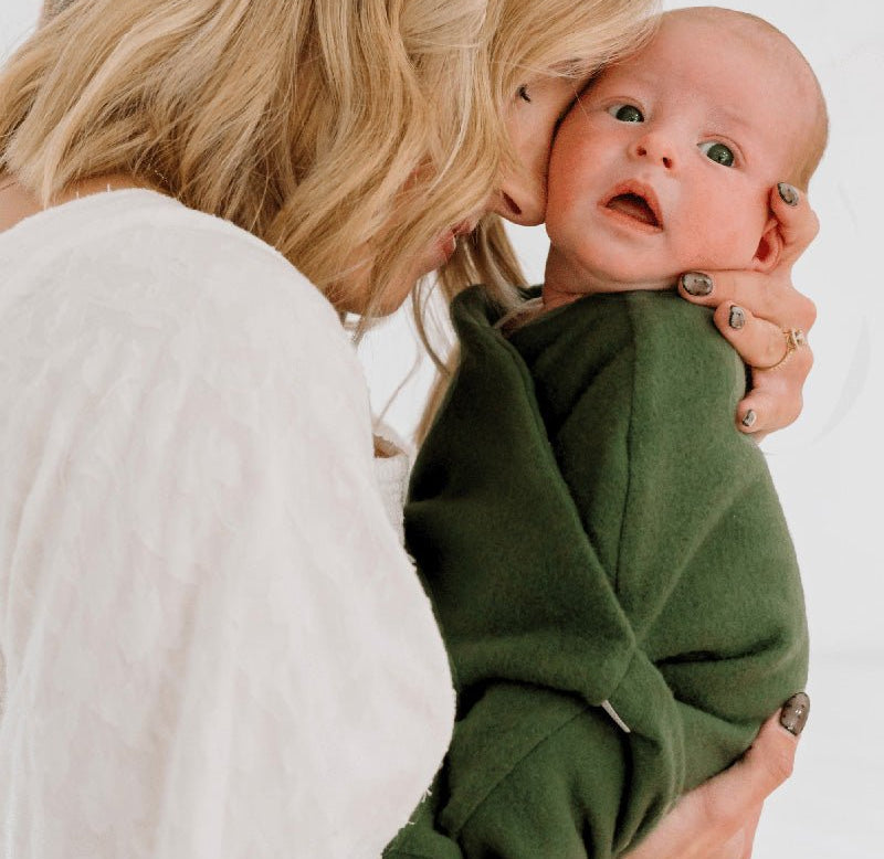Reversible Baby Cocoon swaddle baby blanket in plush juniper pine in plush dream fabric styles.