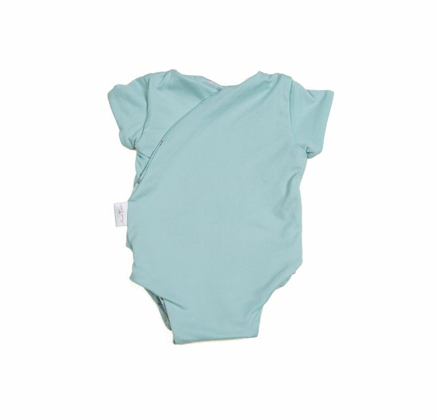 World Traveler print adds a soft look to this reversible short-sleeve winged bodysuit.