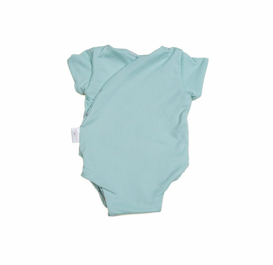World Traveler print adds a soft look to this reversible short-sleeve winged bodysuit.