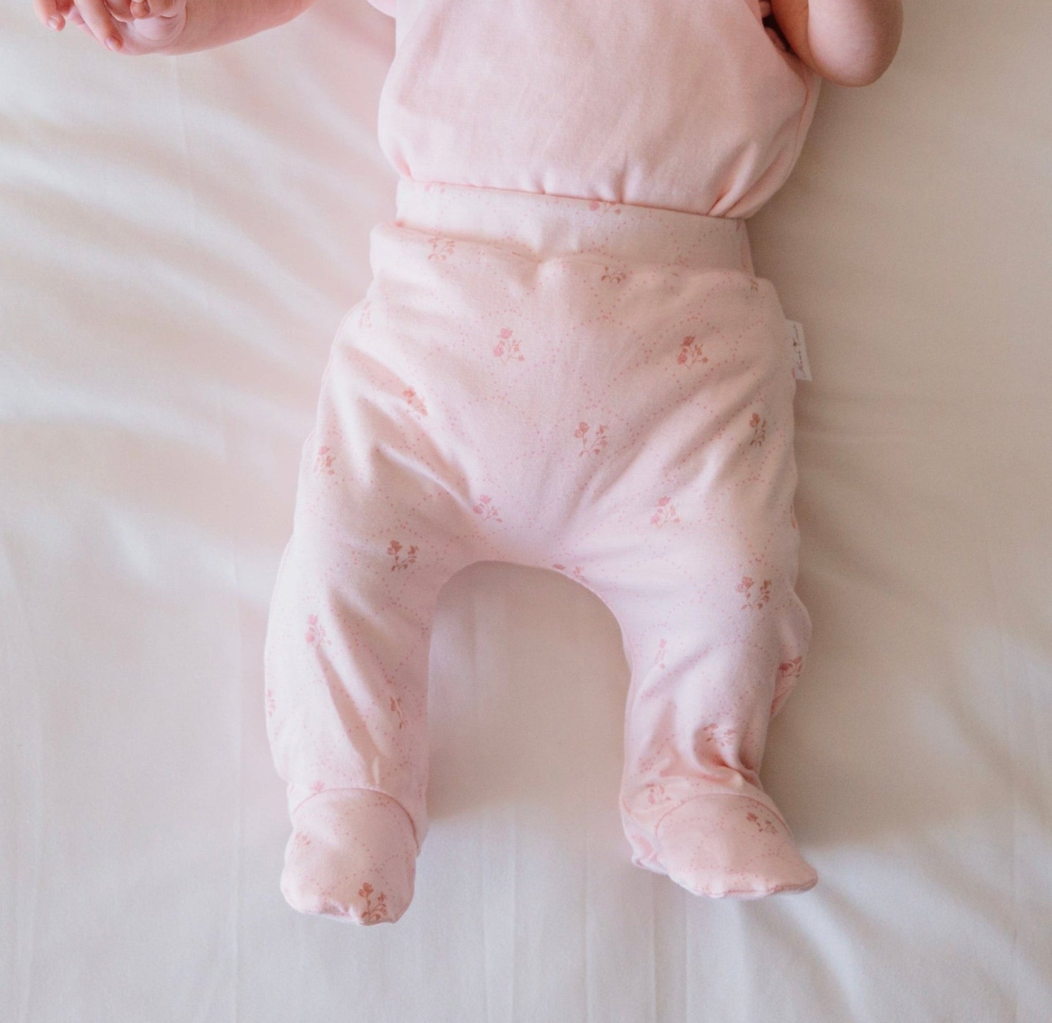 Dainty dots baby footie pants.