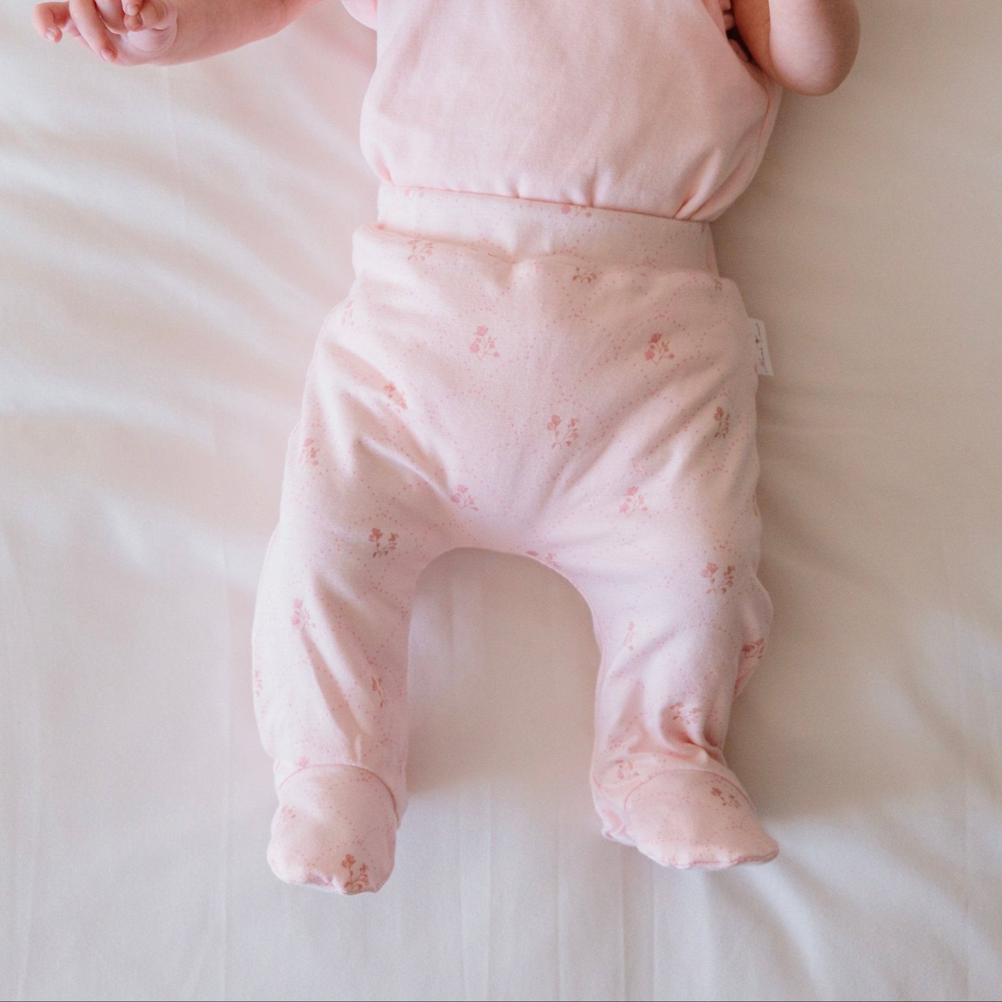 Dainty dots baby footie pants.
