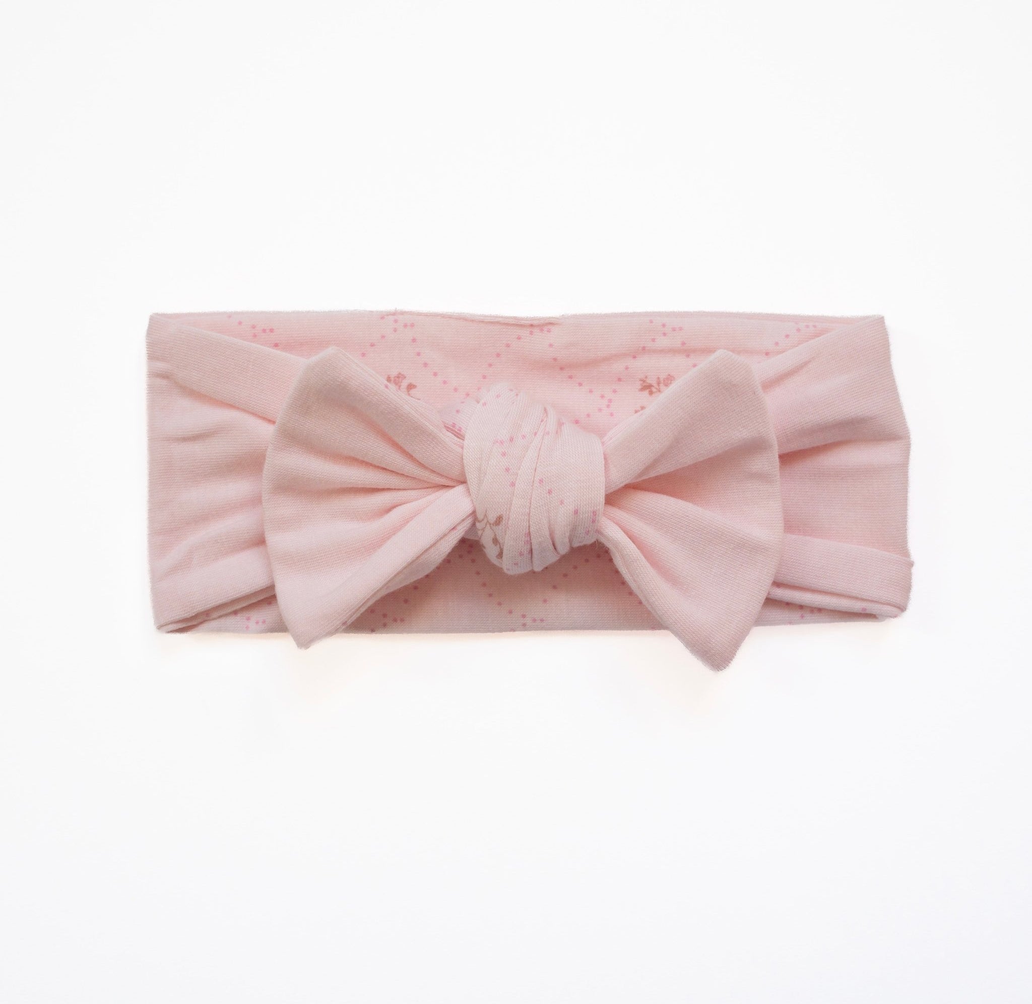 Baby bow headwrap featuring a delicate dainty dots design on bamboo and organic cotton fabric.