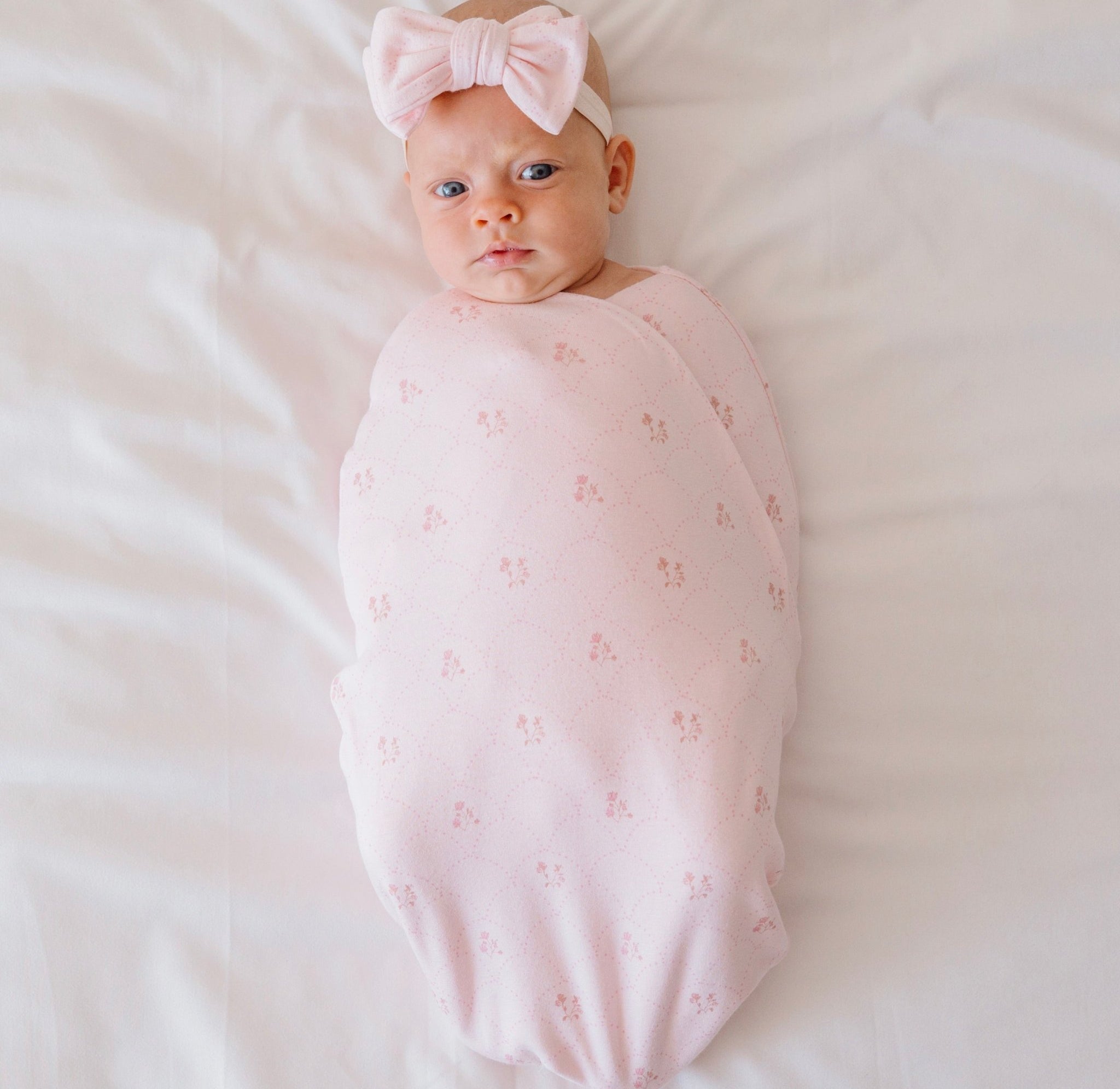 Cocoon swaddle baby blanket made from bamboo and organic cotton fabric with a Dainty Dots pattern.