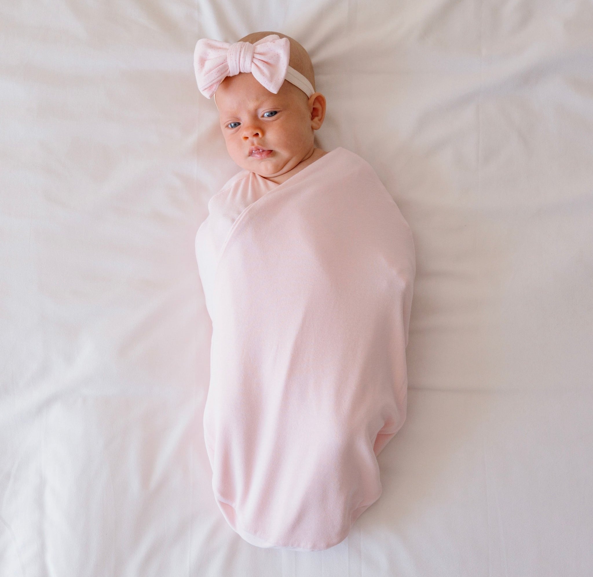 Soft and breathable baby cocoon swaddle blanket made from bamboo-organic cotton blend featuring our Dainty Dots design.