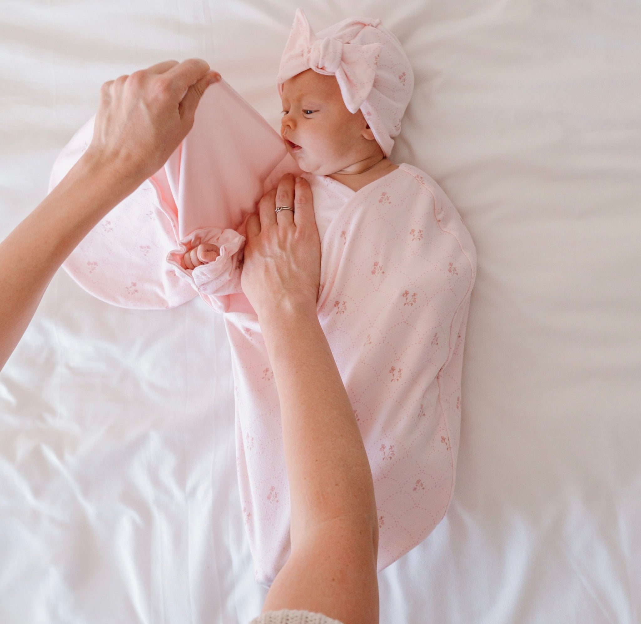 Cocoon-style baby swaddle blanket in breathable bamboo and organic cotton with Dainty Dots print.