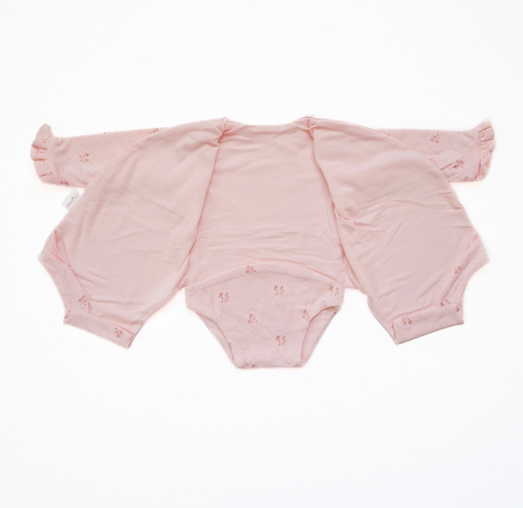 Reversible dainty dots ruffle cuff long sleeve baby onesie.
