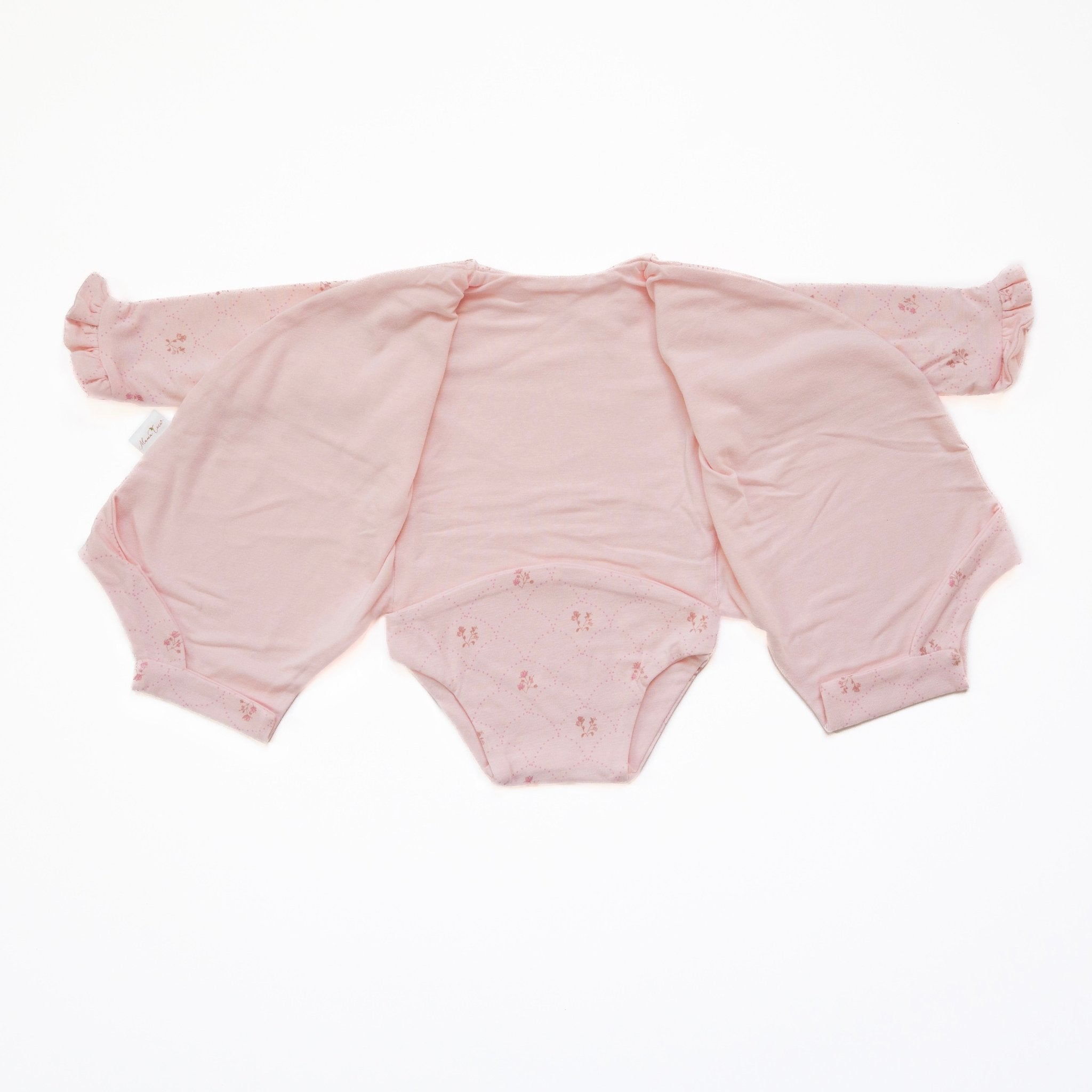 Reversible dainty dots ruffle cuff long sleeve baby onesie.