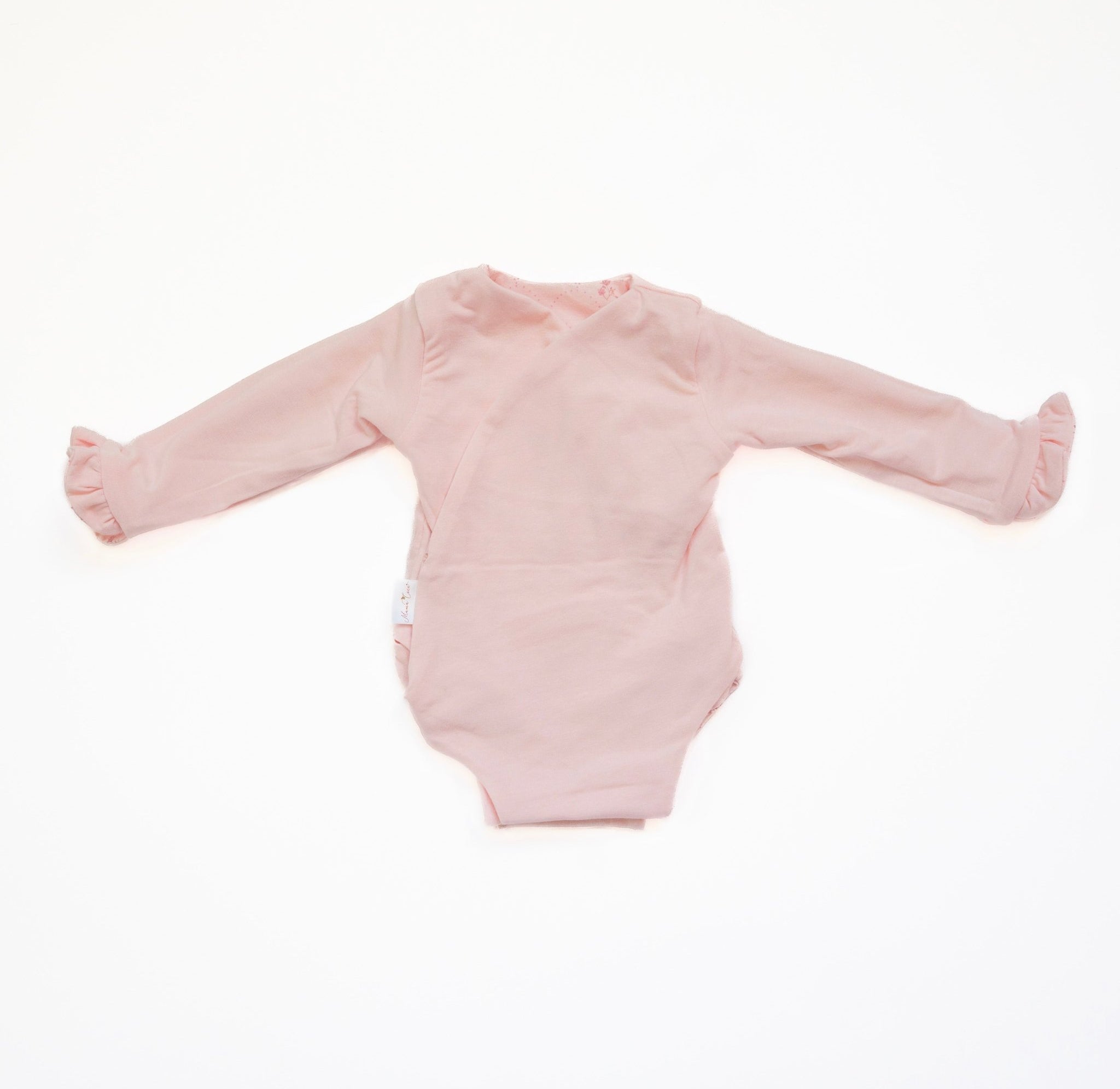 Reversible dainty dots ruffle cuff long sleeve baby winged bodysuit.