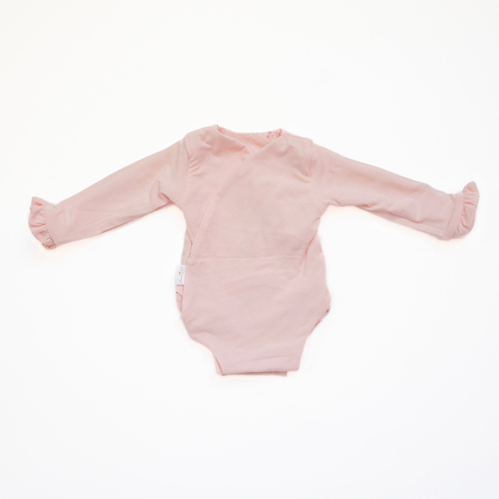 Reversible dainty dots ruffle cuff long sleeve baby winged bodysuit.