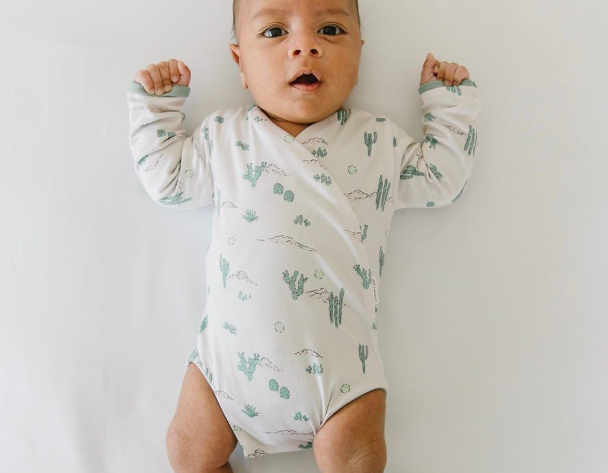 Desert sunsets design long-sleeve baby onesie in classic brushed fabric.