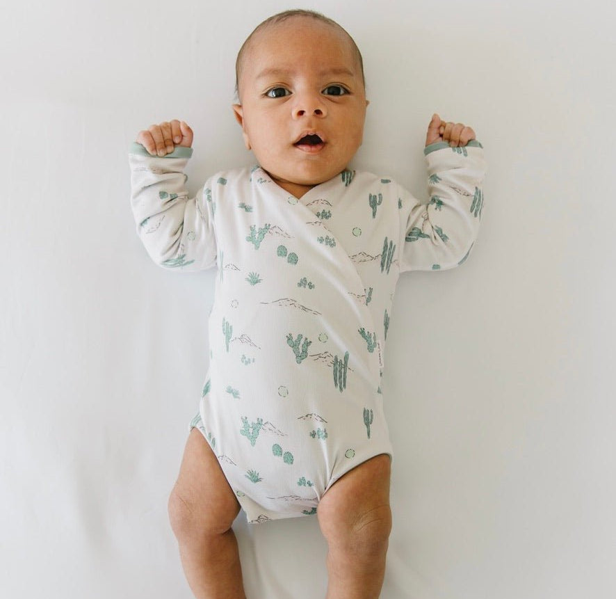 Desert sunsets design long-sleeve baby onesie in classic brushed fabric.