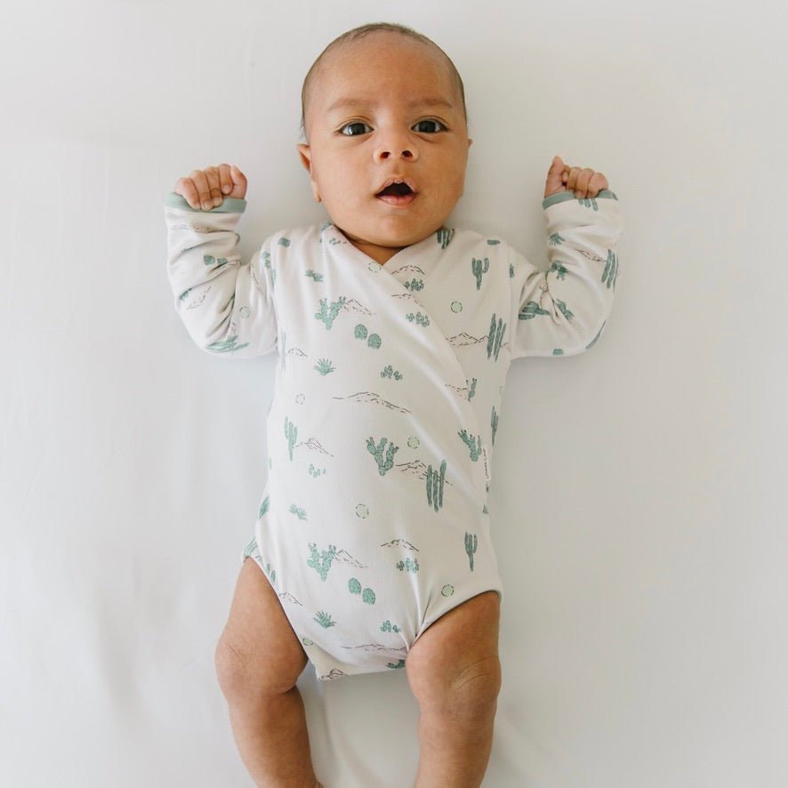 Desert sunsets design long-sleeve baby onesie in classic brushed fabric.