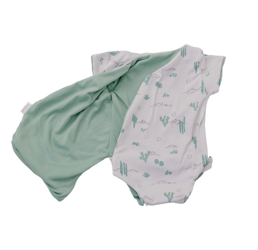 Soft reversible short-sleeve winged bodysuit in the Desert Sunsets design crafted from classic brushed fabric.