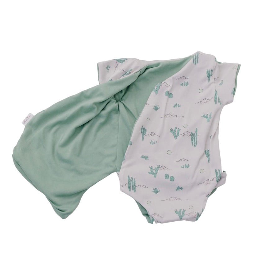 Soft reversible short-sleeve winged bodysuit in the Desert Sunsets design crafted from classic brushed fabric.