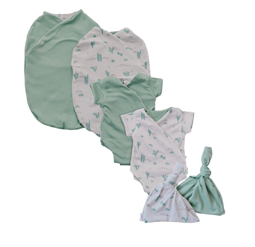 Newborn essentials bundle with short sleeves in classic brushed fabric with desert sunsets design.