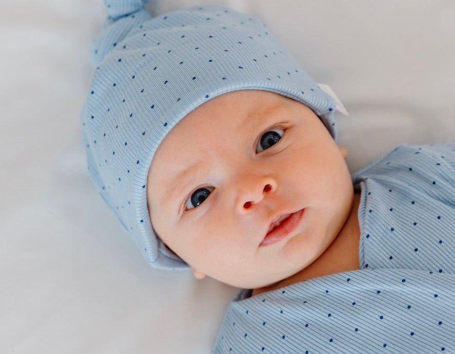 Silky modal baby beanie in dotted blues design.