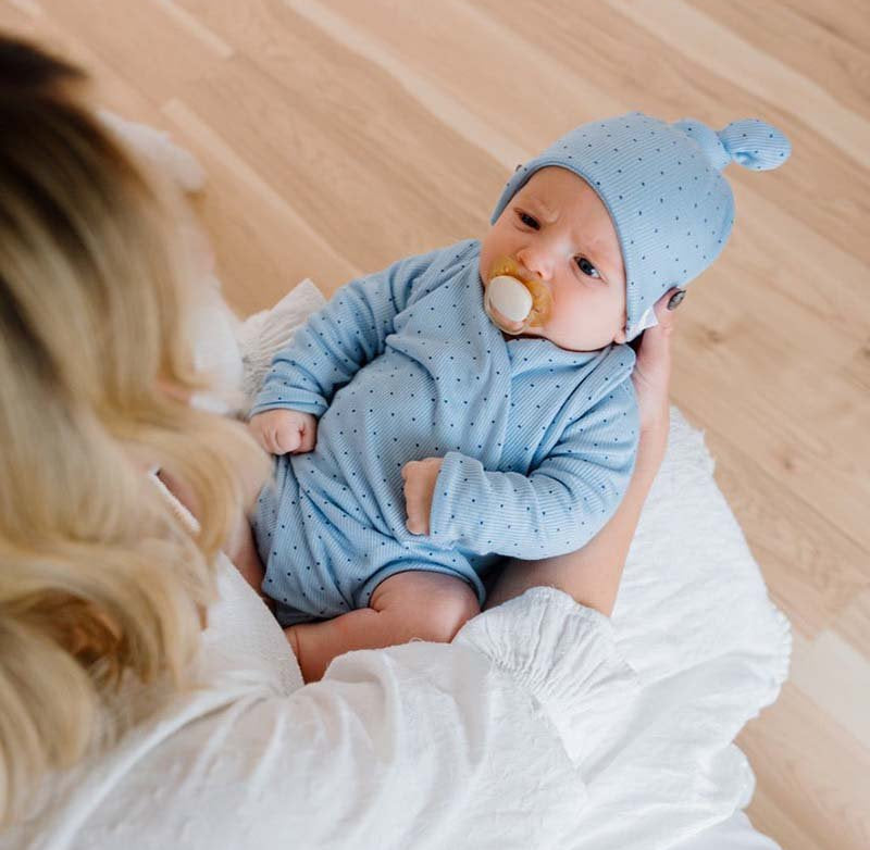 Dotted Blues design long-sleeved winged bodysuit in silky modal fabric.