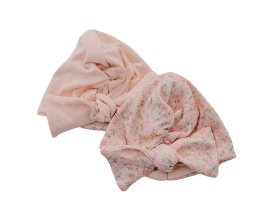 Reversible classic brushed baby beanie in dusty roses design.