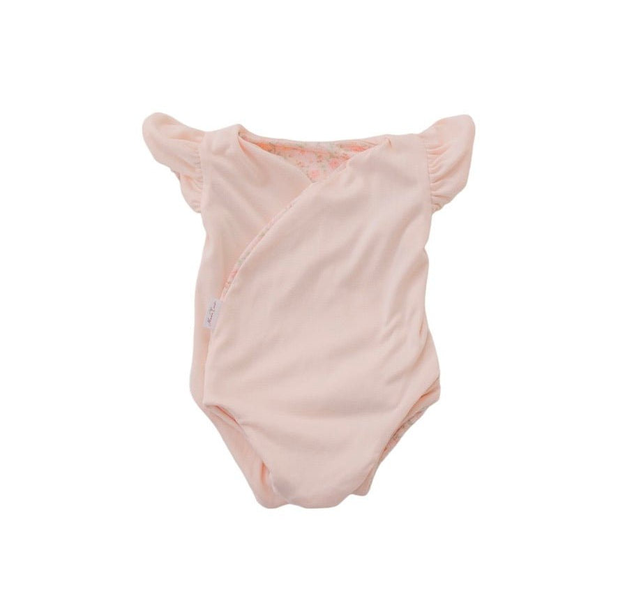 Reversible Dusty Roses floral baby bodysuit with comfortable short sleeves.