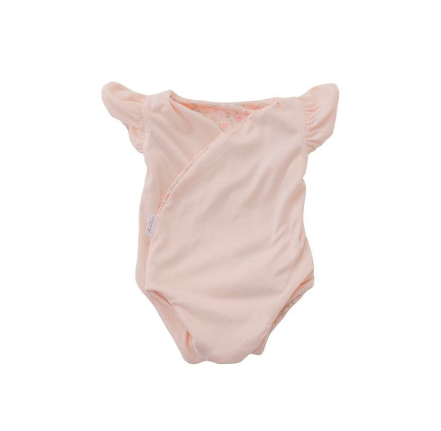 Reversible Dusty Roses floral baby bodysuit with comfortable short sleeves.