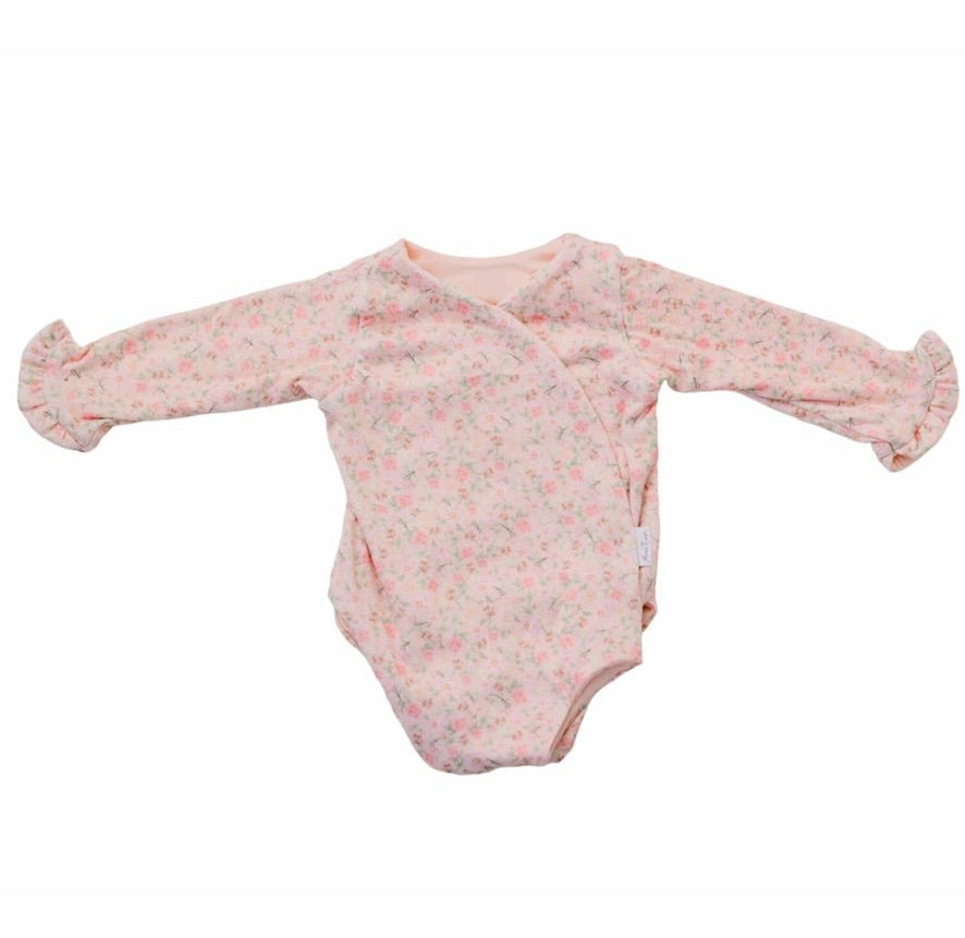 Boutique-style long sleeve baby bodysuit with ruffle cuff accents in Dusty Roses design brushed fabric.