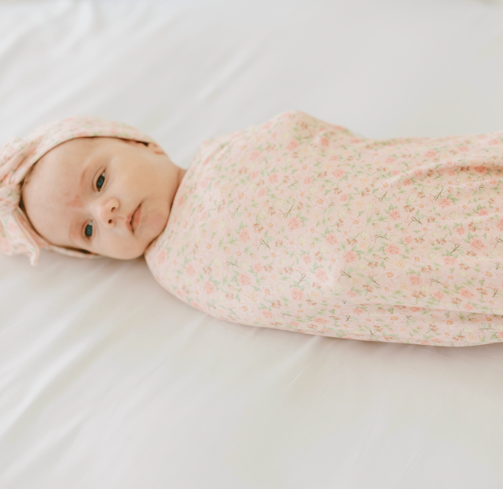 Dusty Roses design baby cocoon swaddle.