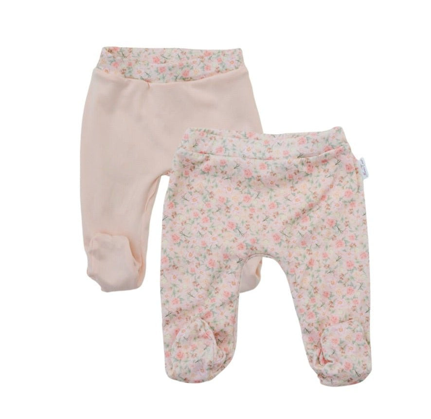 Reversible dusty roses design footie pants.