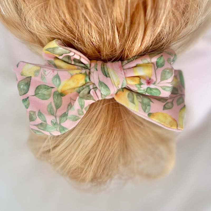 Pink Lemonade baby hair bow headband and clip set for newborns and infants.