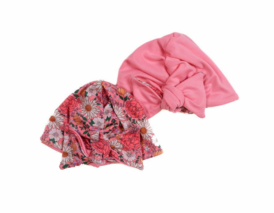 Reversible classic brushed baby knotty beanie in flower power design.