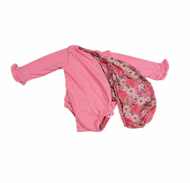 Baby long sleeve bodysuit in Flower Power design brushed fabric featuring wing details and ruffle cuffs.