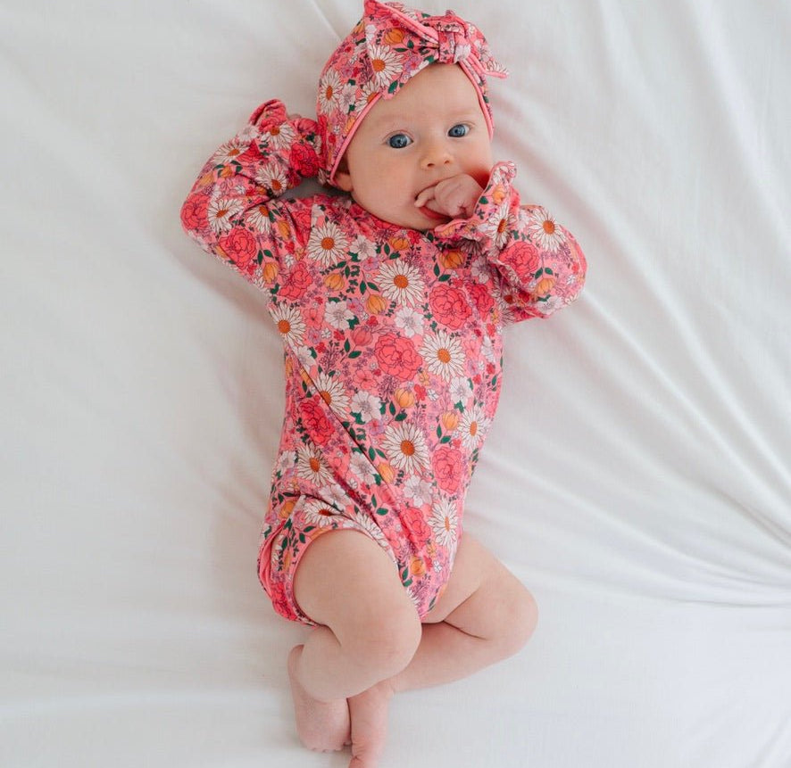 Ruffle cuff baby bodysuit with wings in Flower Power design classic brushed fabric.