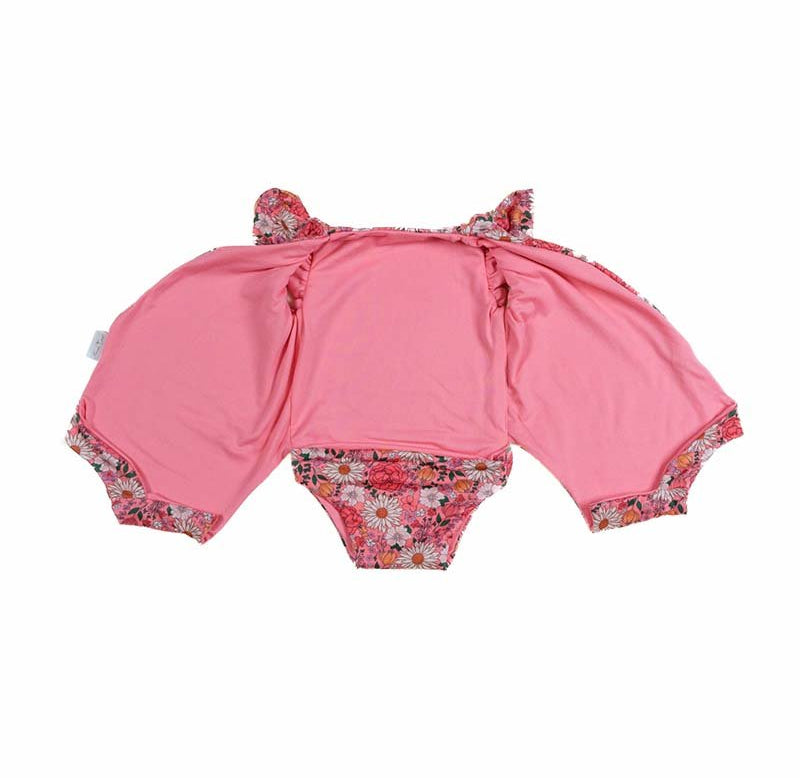Reversible boutique baby bodysuit in Flower Power print and Classic Brushed fabric styles.