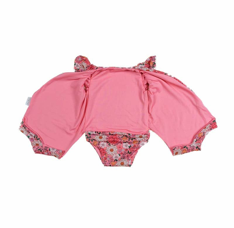 Reversible boutique baby bodysuit in Flower Power print and Classic Brushed fabric styles.