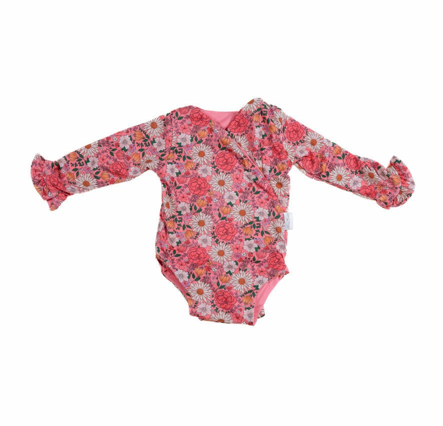Winged long sleeve infant bodysuit crafted from cozy Flower Power design brushed fabric with ruffle cuffs.