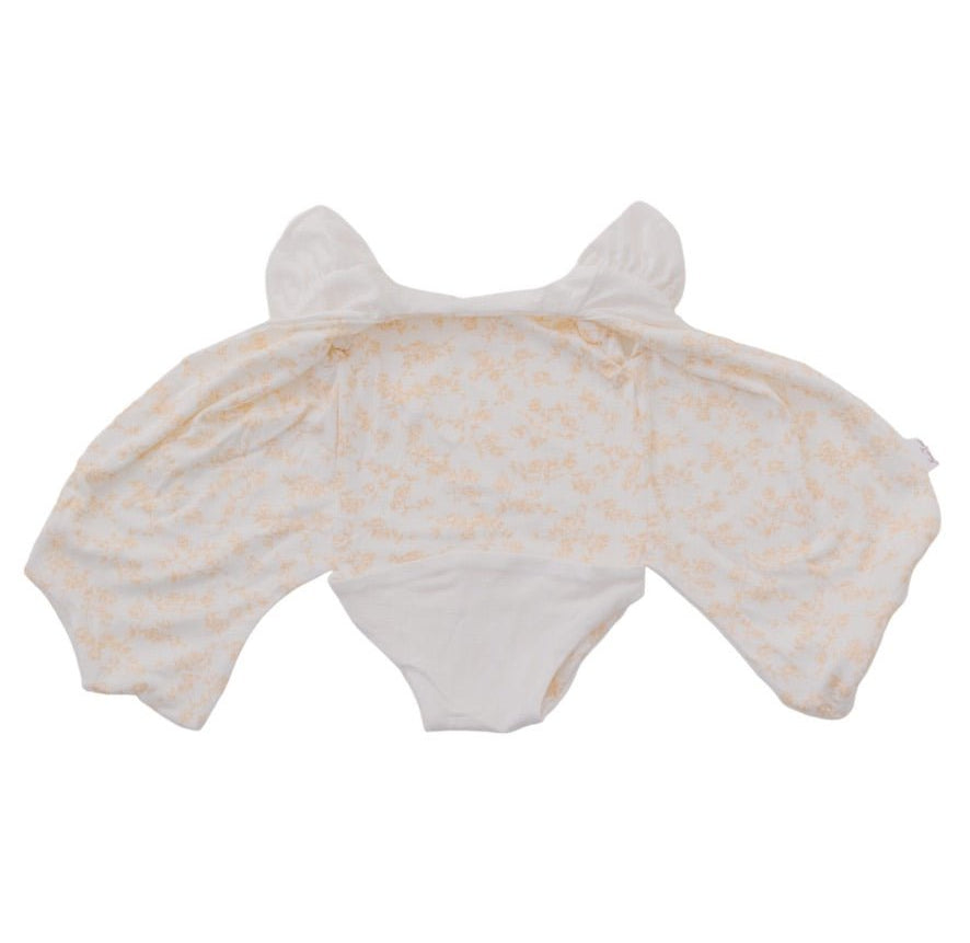 Baby flutter sleeve onesie made from silky modal fabric in Bitty Blooms design.
