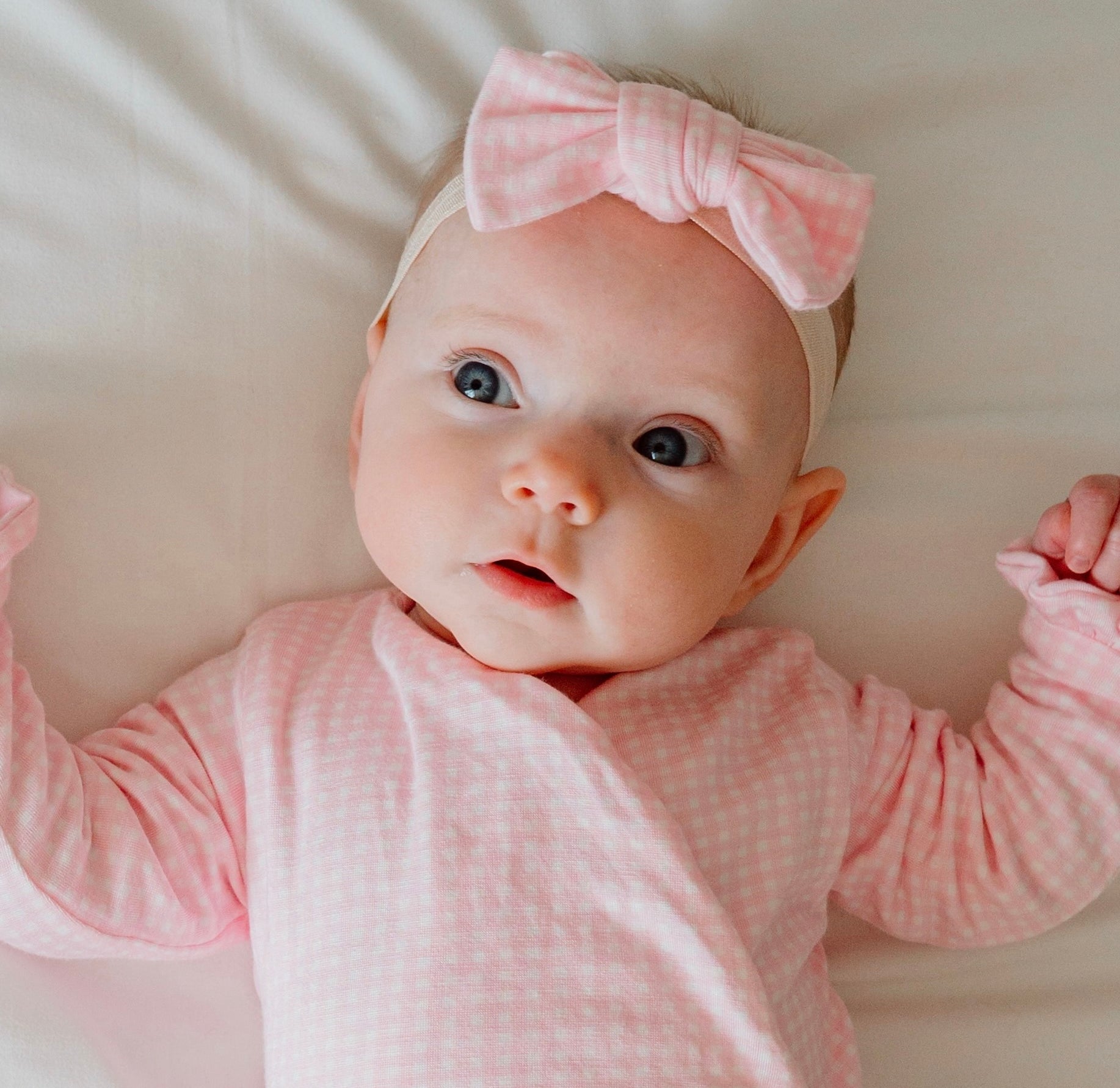 Flutter sleeve baby onesie outfit bundle made from silky modal fabric in baby pink gingham design.