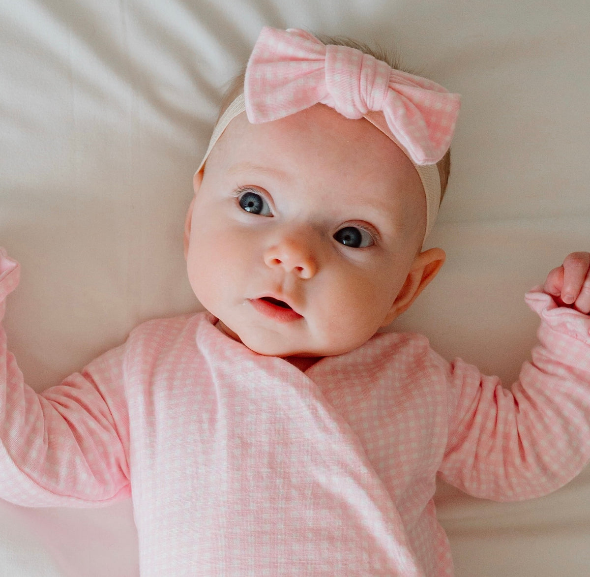 Flutter sleeve baby onesie outfit bundle made from silky modal fabric in baby pink gingham design.