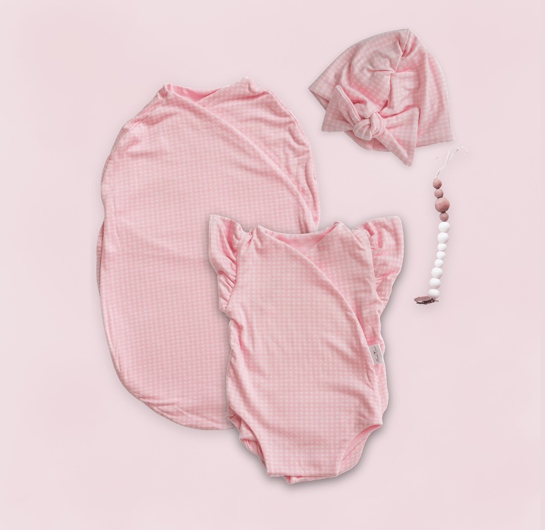 Newborn essentials bundle with flutter sleeves in silky modal fabric with baby pink gingham design.