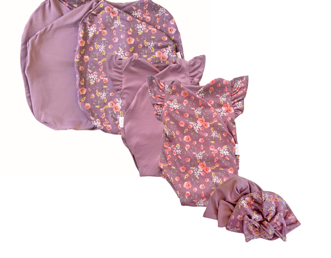 Newborn essentials bundle with flutter sleeves in classic brushed fabric with peachy lilac design.