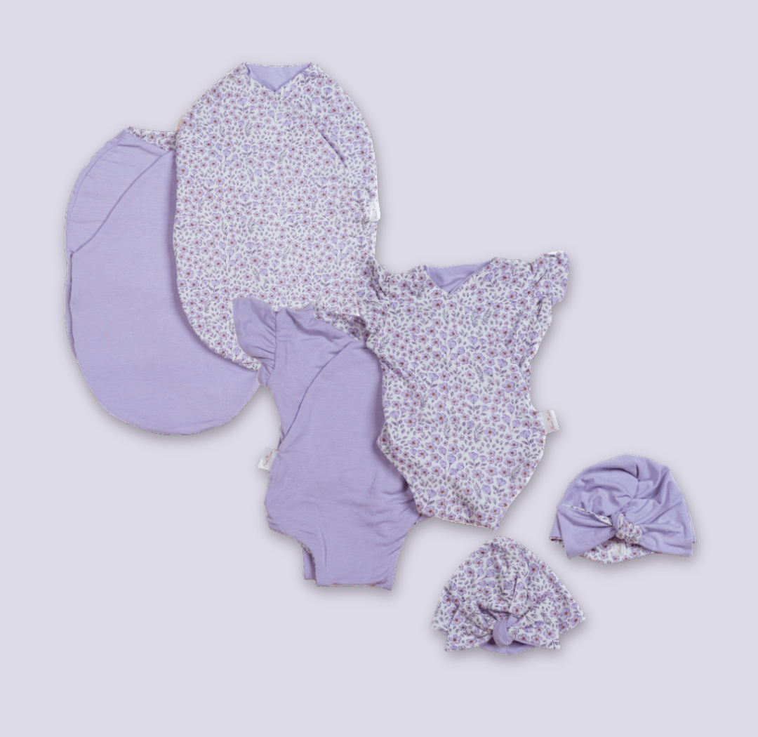 Newborn essentials bundle with flutter sleeves in silky modal fabric with purple posies design.
