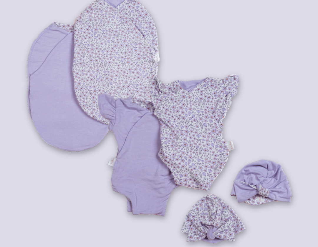 Newborn essentials bundle with flutter sleeves in silky modal fabric with purple posies design.