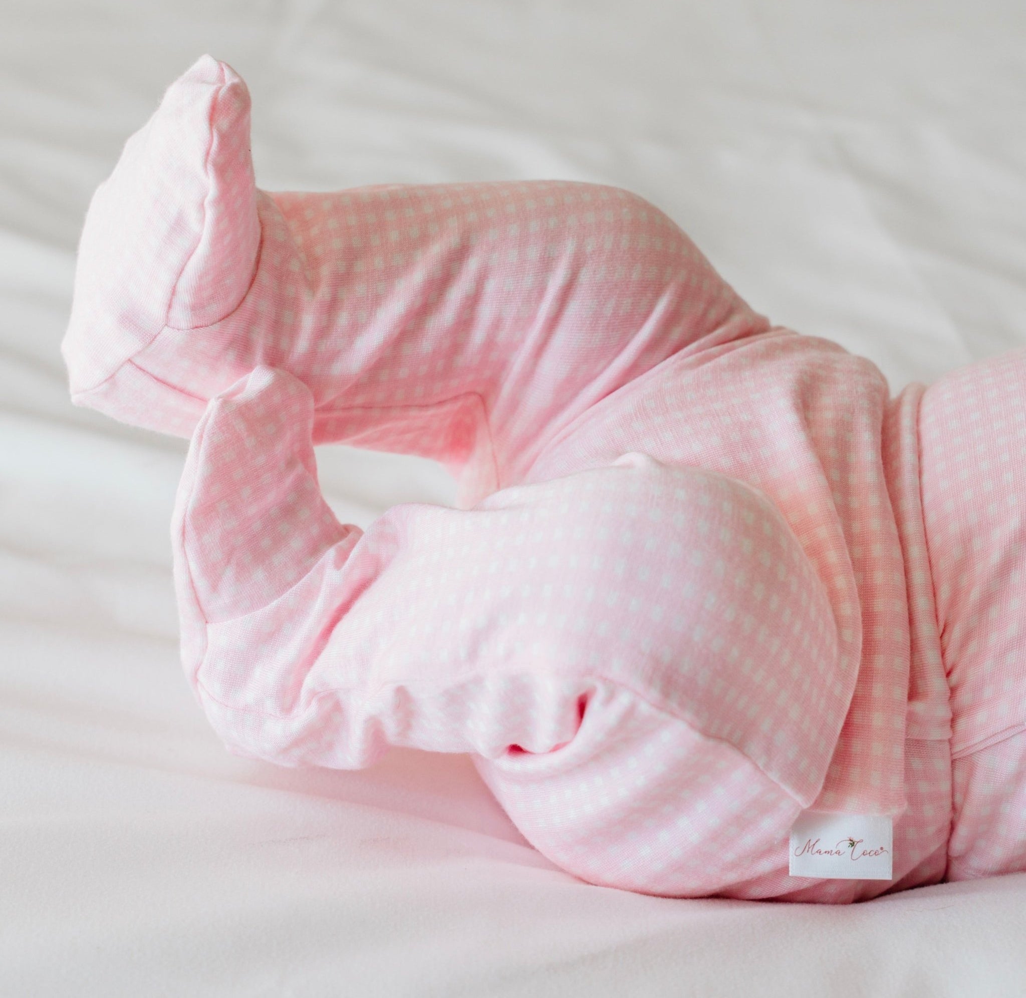 Baby footie pants in baby pink gingham design.