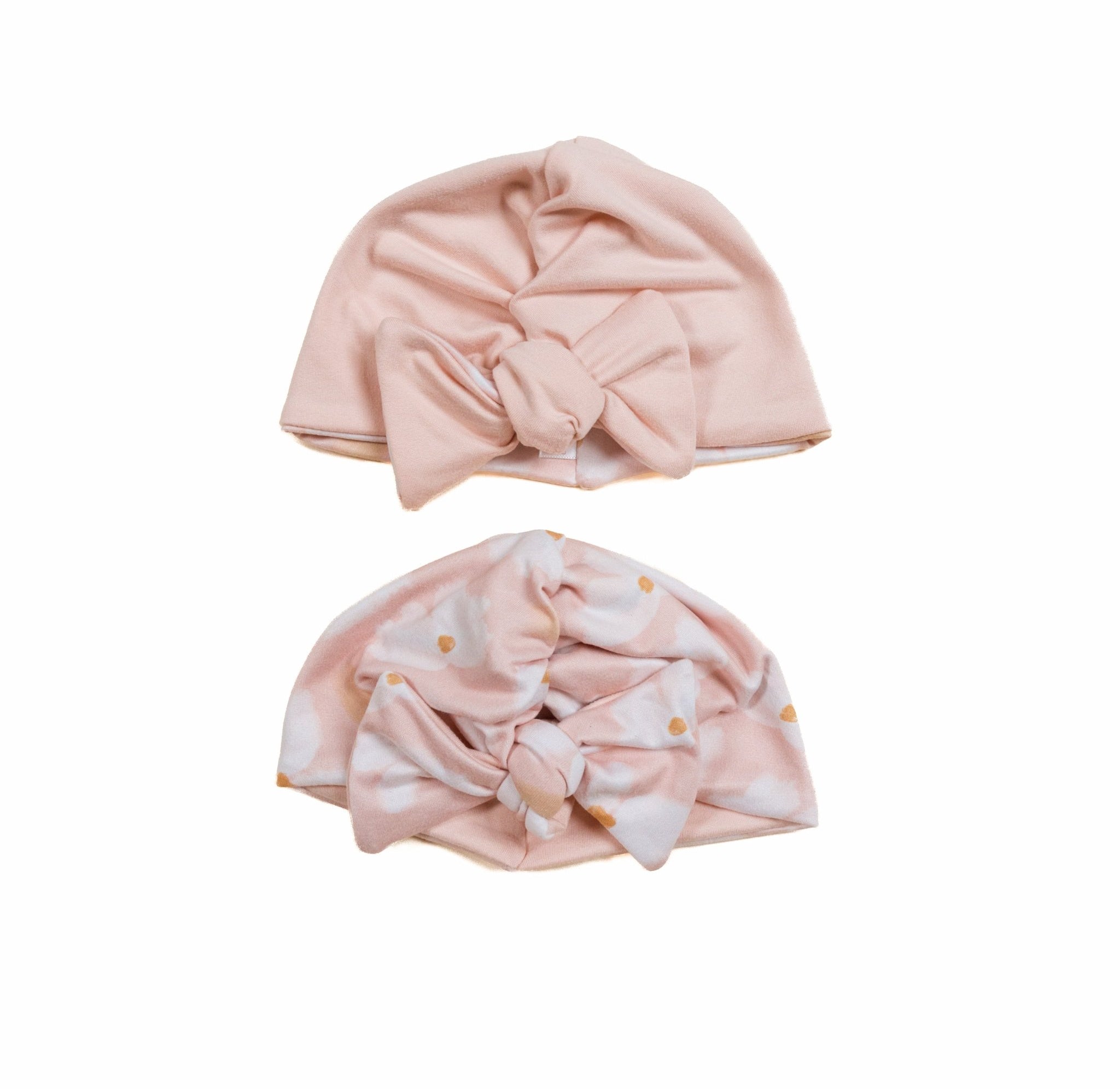 Soft reversible ruched baby beanies with bow made from classic brushed fabric in the Dusty Roses design.