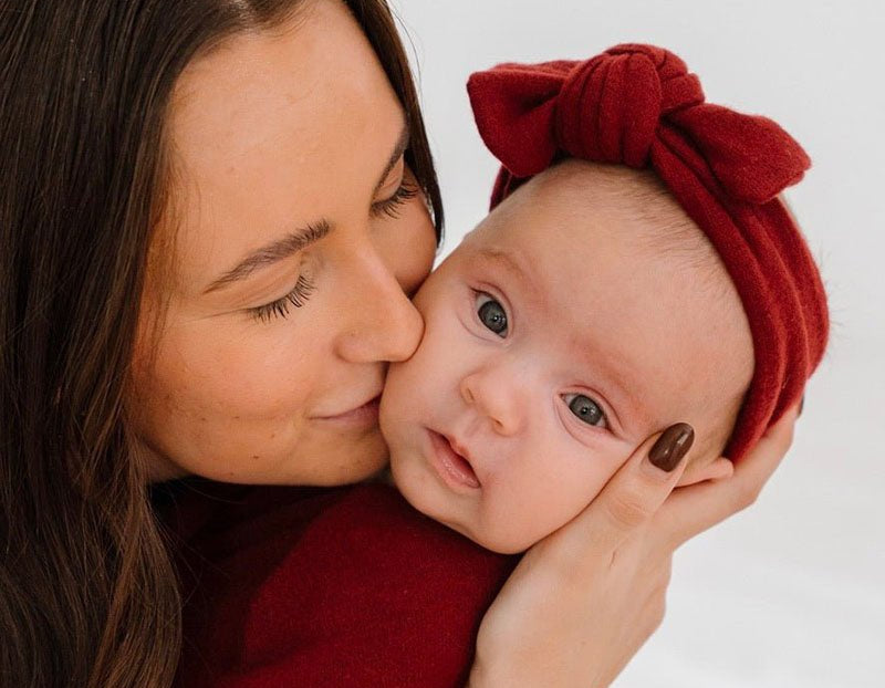 Baby headwrap with bow crafted in soft Plush Dark Cherry fabric.