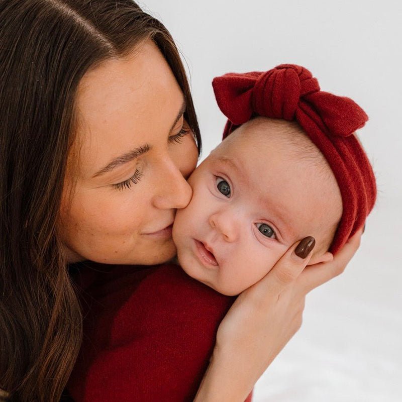 Baby headwrap with bow crafted in soft Plush Dark Cherry fabric.